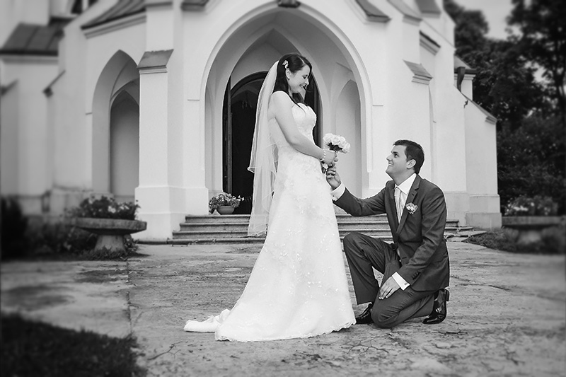 Husband and wife in front of the church